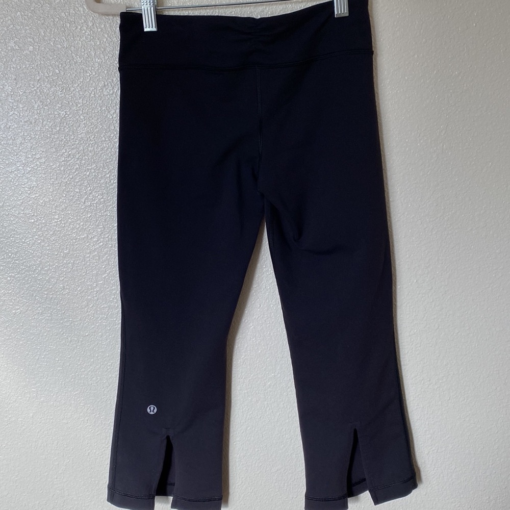 Lululemon Tadasana Slit crop pants. Black in color and size 4